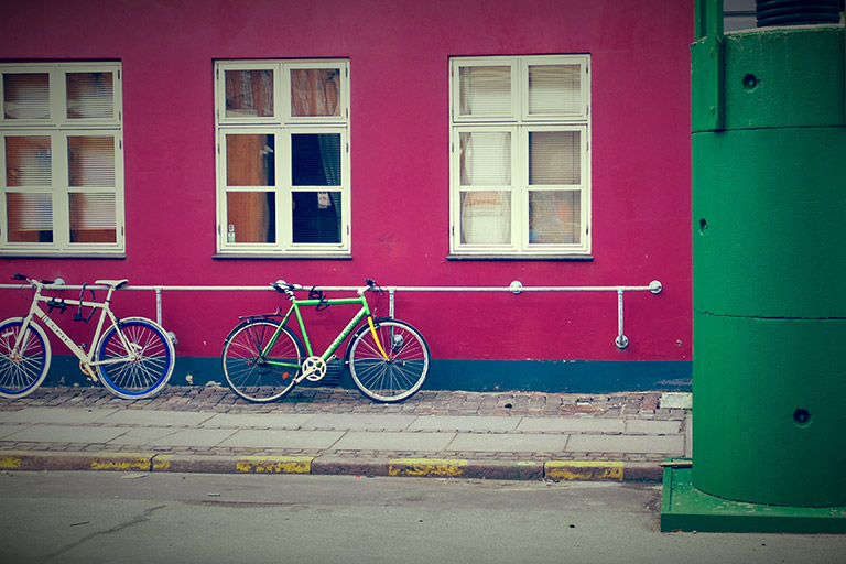 Bikes parked on a pink wall in Denmark